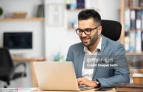 Portrait of a handsome young businessman working in office